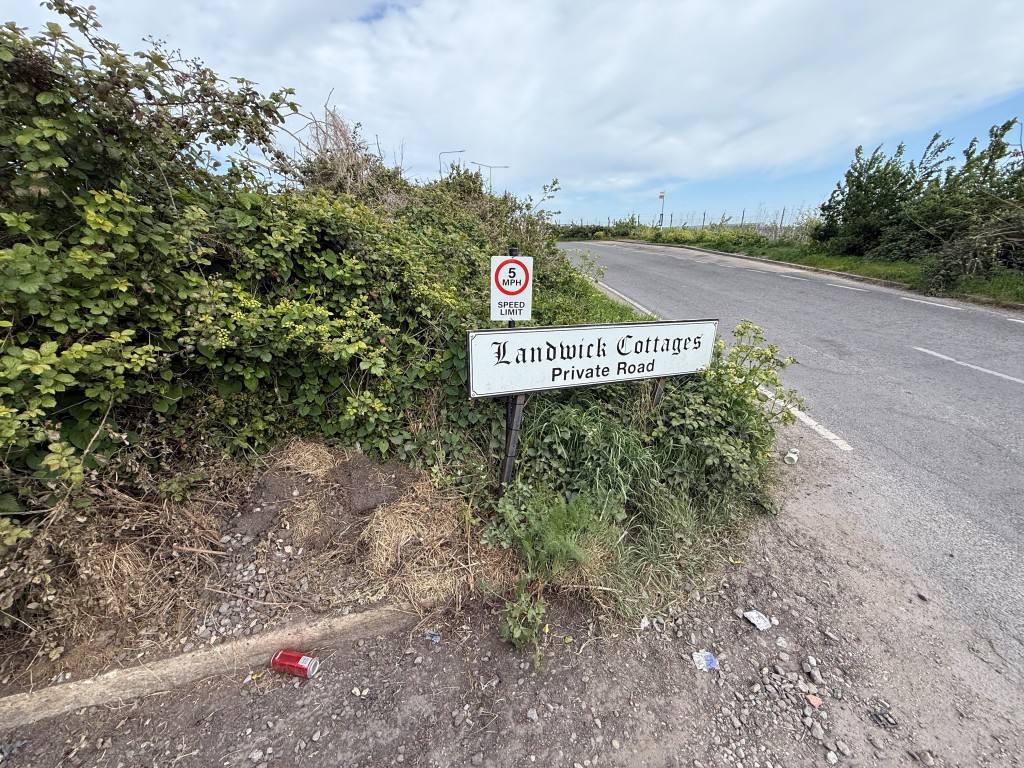 Lot: 12 - PARCEL OF LAND WITH POTENTIAL - Road sign by the entrance
